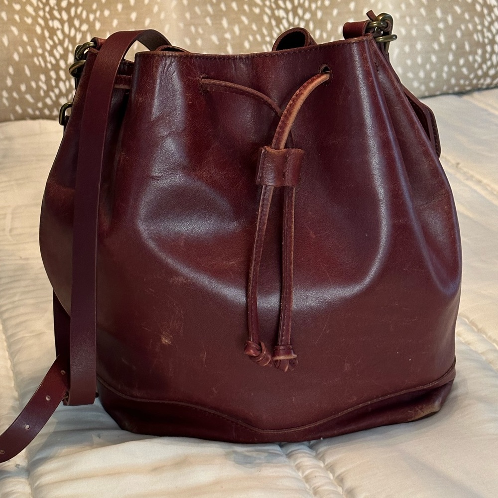Madewell bucket bag in burgundy.